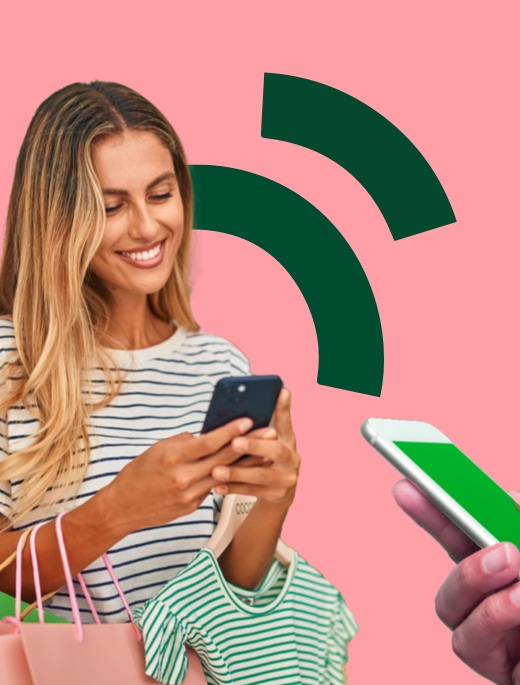 Woman paying with mobile on SoftPos solution in high-street fashion store