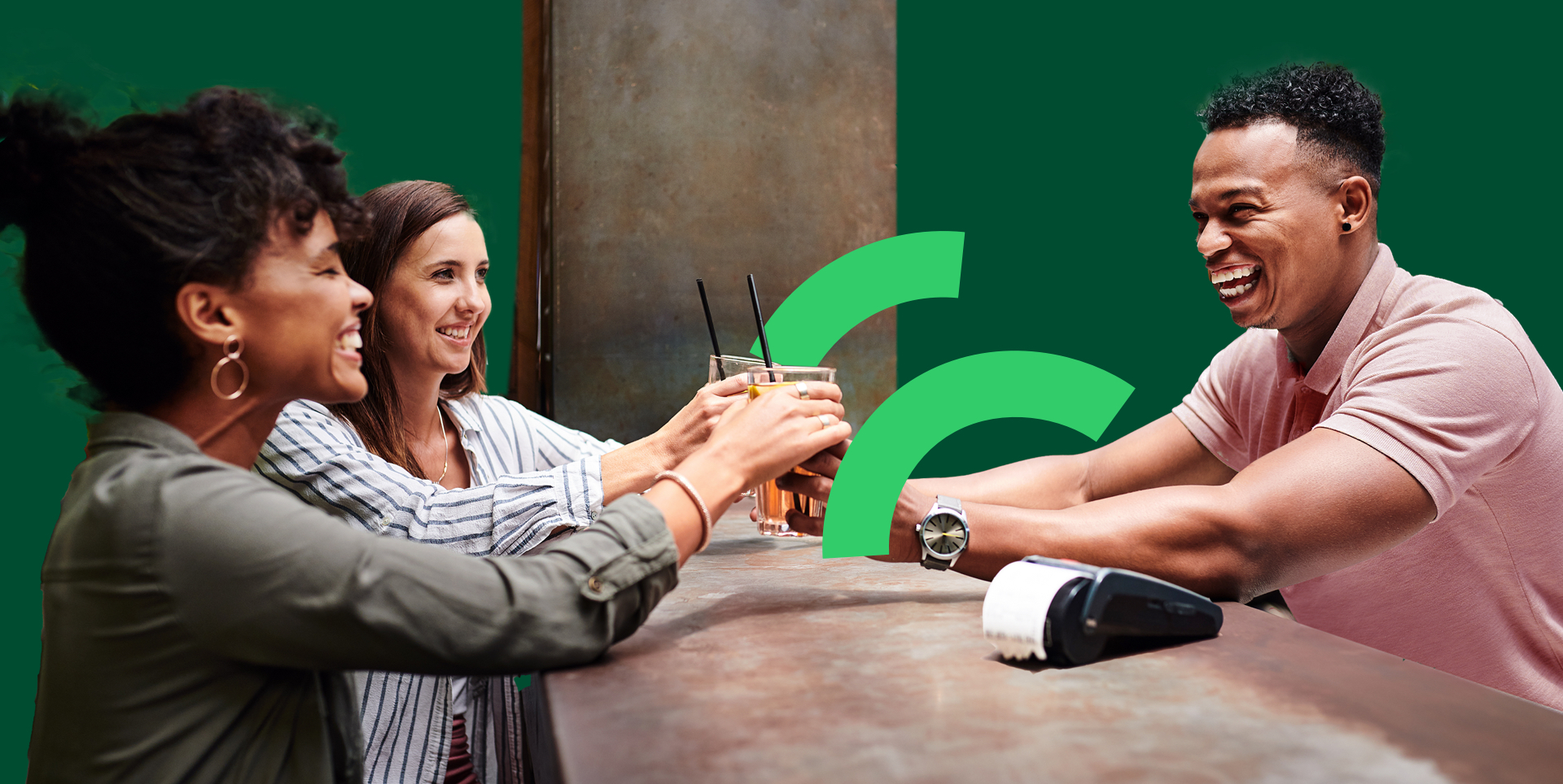 Bar man serving drinks using contactless payments