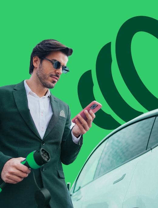 Man holding charging plug for electric car and charging app