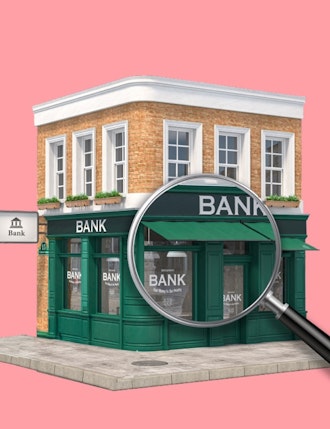 Bank building with magnifying glass | What is a merchant acquirer?