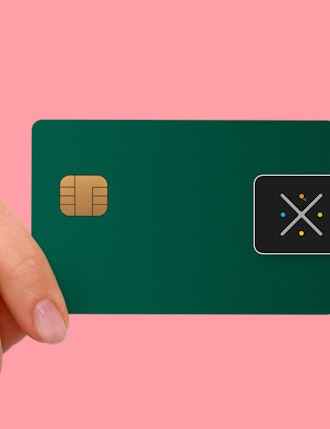 Hand with creditcard showing Nexo payment standard