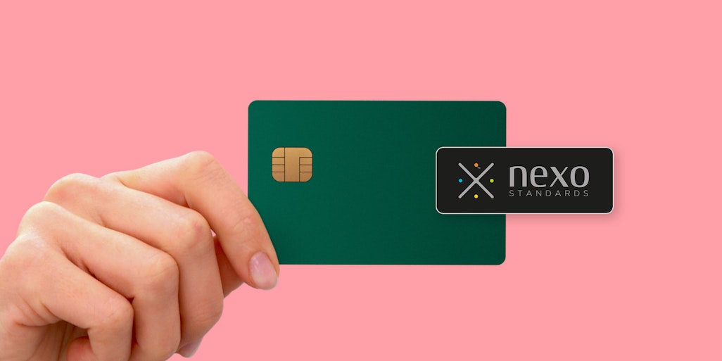 Hand with creditcard showing Nexo payment standard