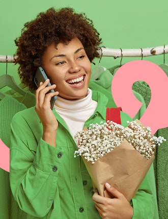 Woman holding phone and flowers