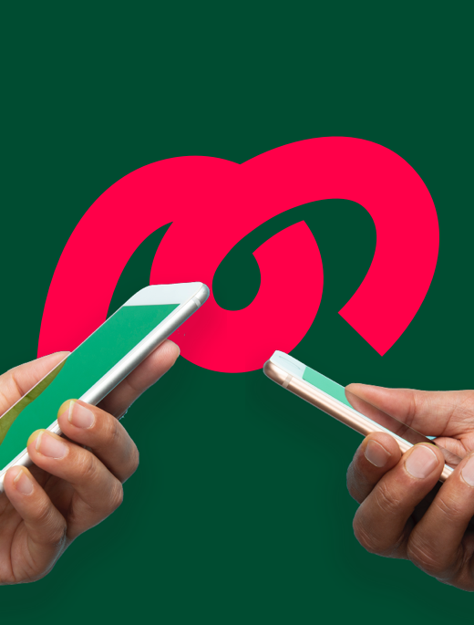 two hands holding iphones