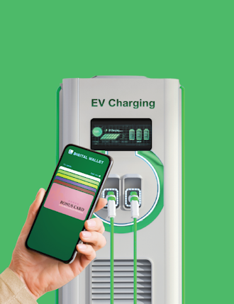 The future of EVs and payments - hand with mobile phone app near EV charger