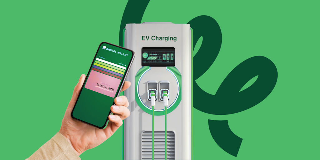 The future of EVs and payments - hand with mobile phone app near EV charger