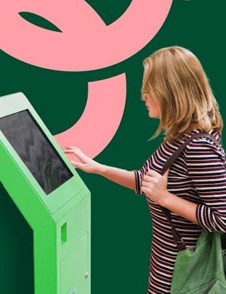 Unattende payments | Woman touching self service kiosk