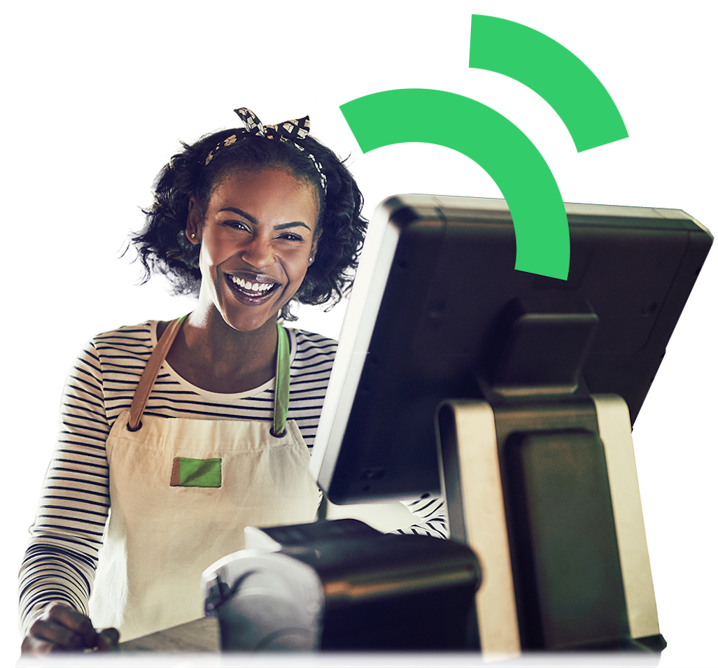 Cheerful woman using a cash register or Point of Sale