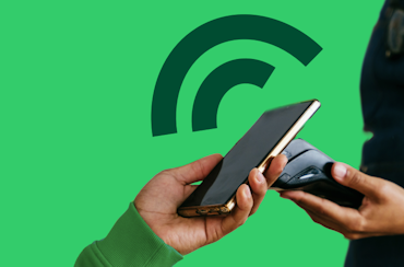 Barista receiving in-person payment from mobile phone using SmartPOS