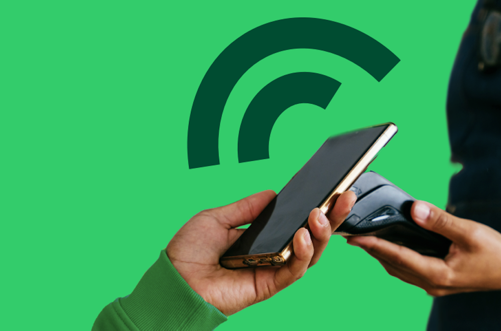 Barista receiving in-person payment from mobile phone using SmartPOS