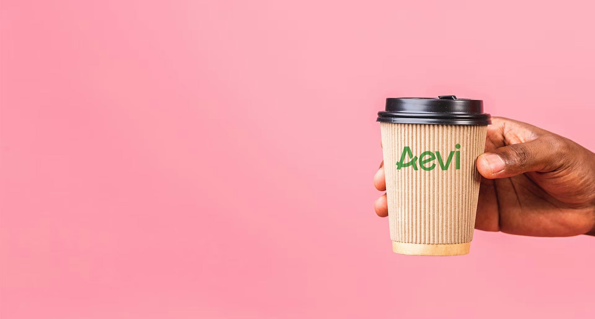 Hand holding coffee cup