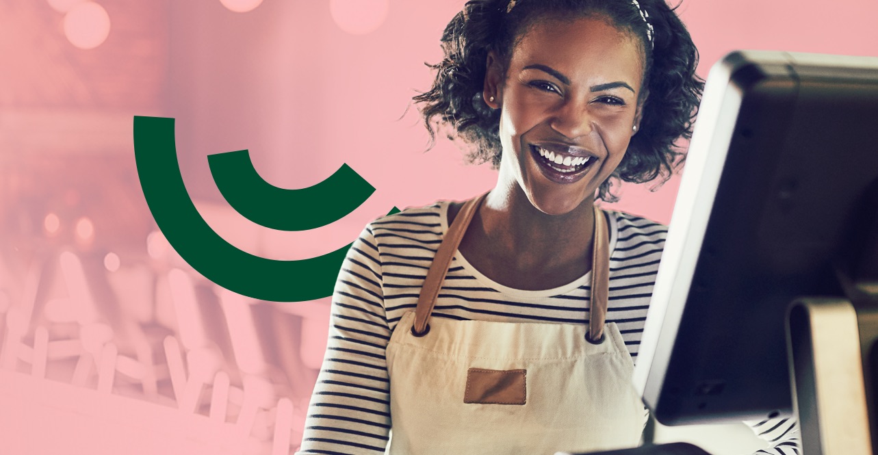 Smily lady behind the till for cafe or coffie bar