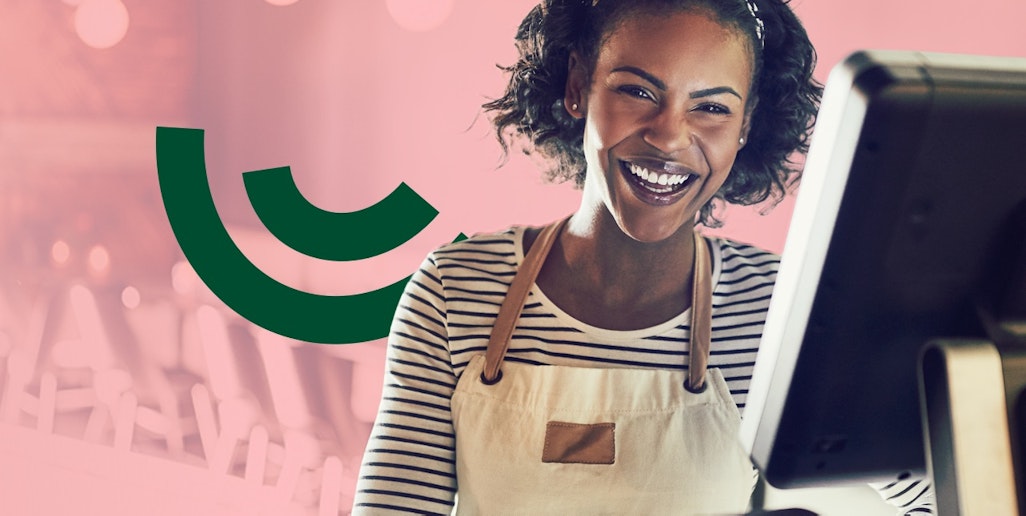 Smily lady behind the till for cafe or coffie bar