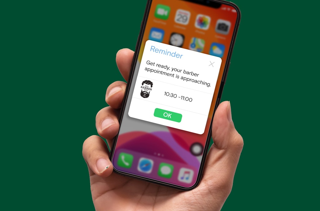Phone with EPOS app showing barbers appointment