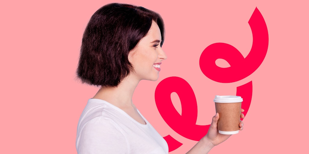 woman holding coffee cup