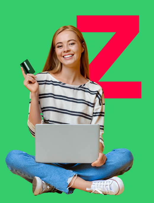 Woman holding card and laptop