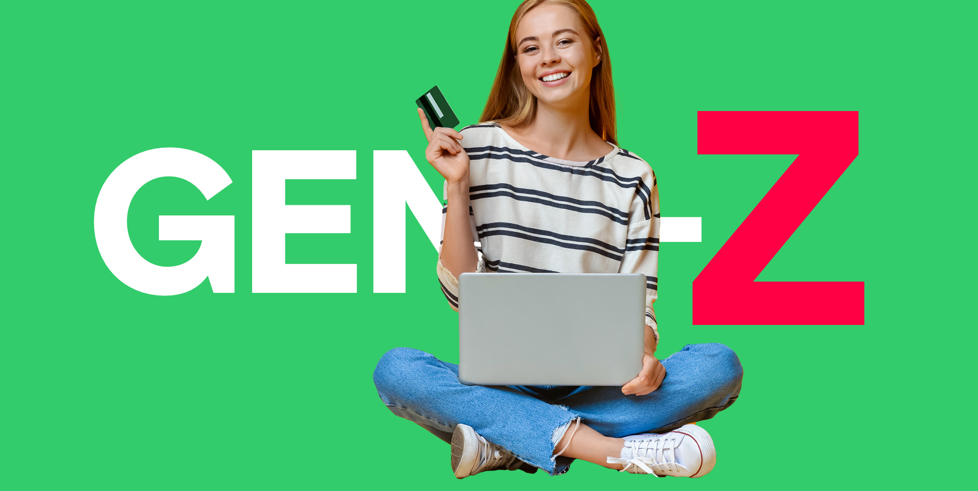 Woman holding card and laptop