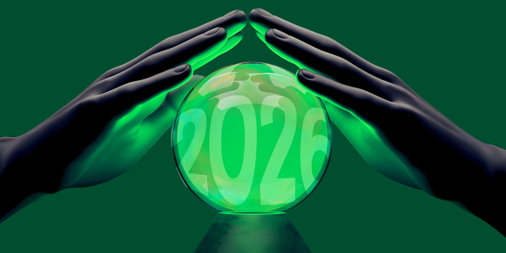Hands above a Christal ball with payment prediction 2026