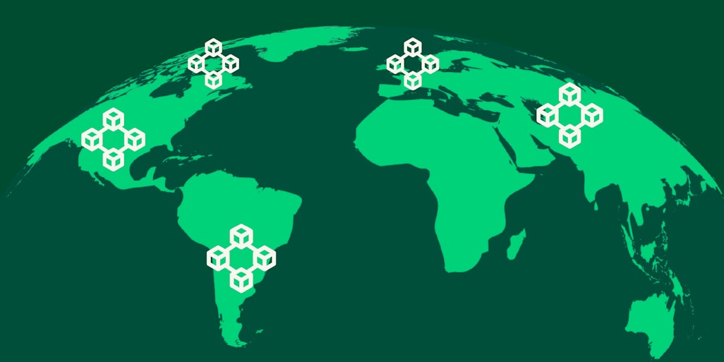 a globe with several blockchain icons on different continents