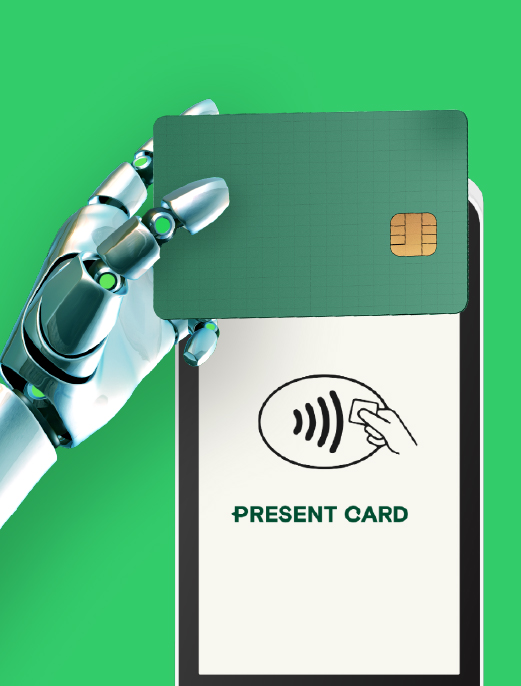 a robot hand holding a card over a payment device