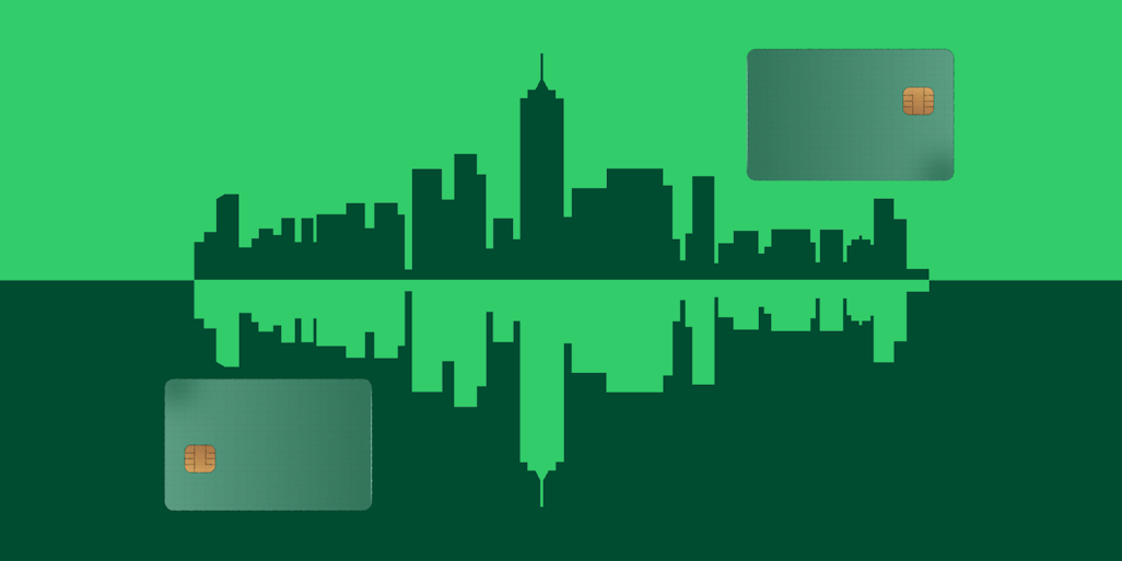 mirrored city skyline with payment cards