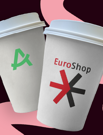 Cup with Aevi logo and cup with EuroSHOP logo next to each other