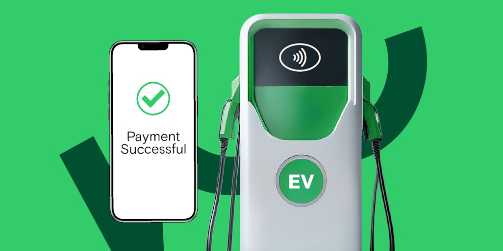 Phone showing successful payment next to an EV charger
