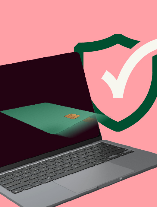 laptop with card flying into it, behind it a security check sign