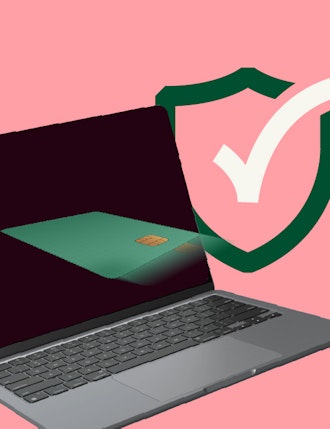 laptop with card flying into it, behind it a security check sign