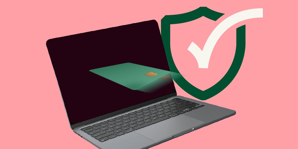laptop with card flying into it, behind it a security check sign