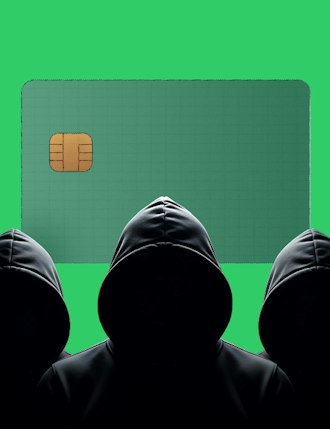 hooded figures in front of payment card