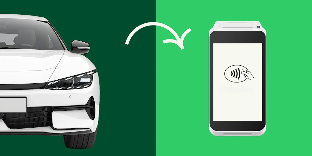 a car next to a payment device