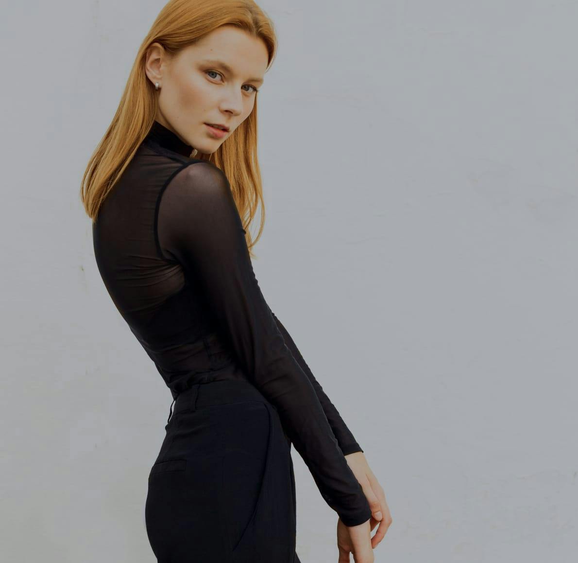 Woman in black looking to her right