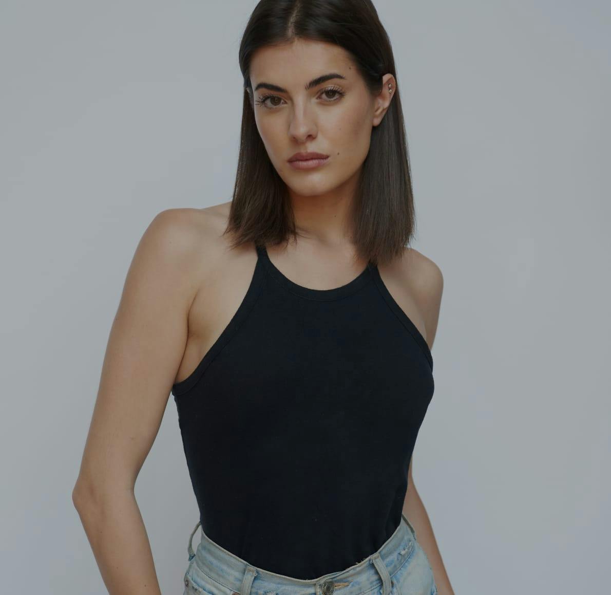 Woman wearing black top and jeans