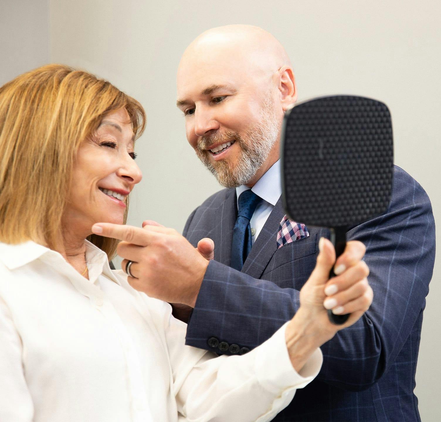 Dr. Warner examining patient's face