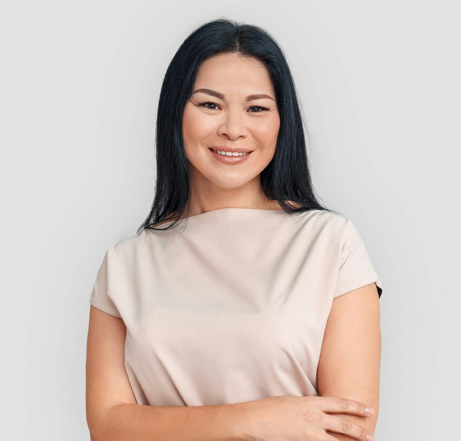 Woman smiling with arms crossed