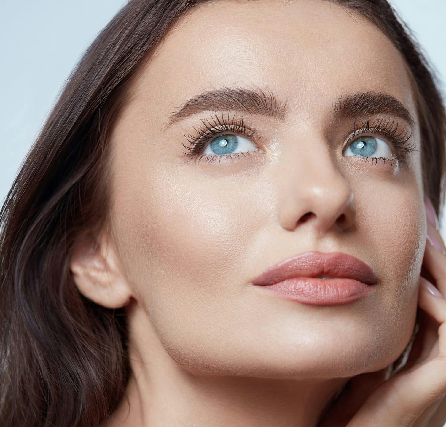 woman with blue eyes looking up