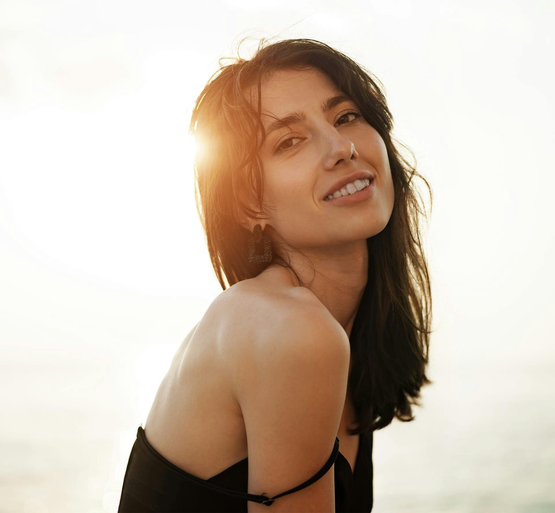 woman smiling over her shoulder