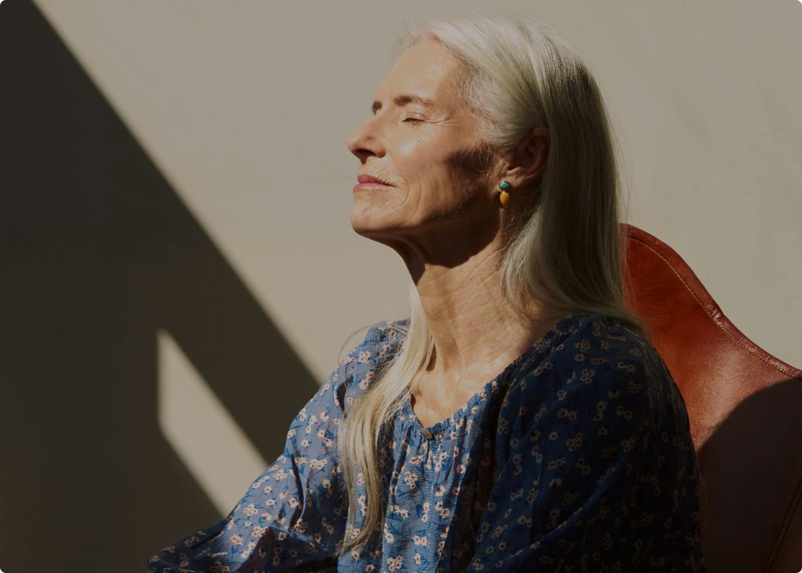 Older woman sitting in chair