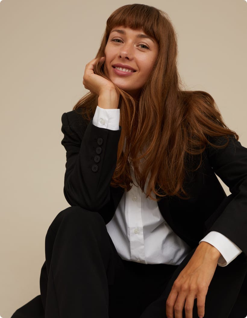 A model in a suit smiling