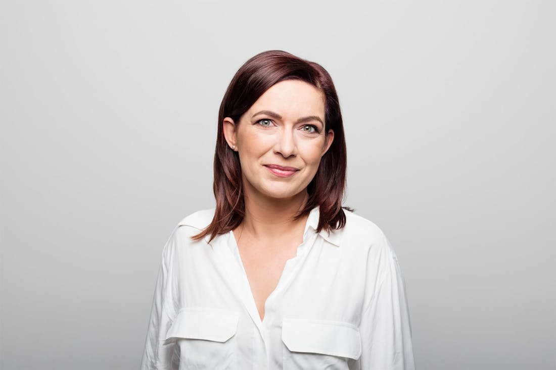 Older woman in white button up