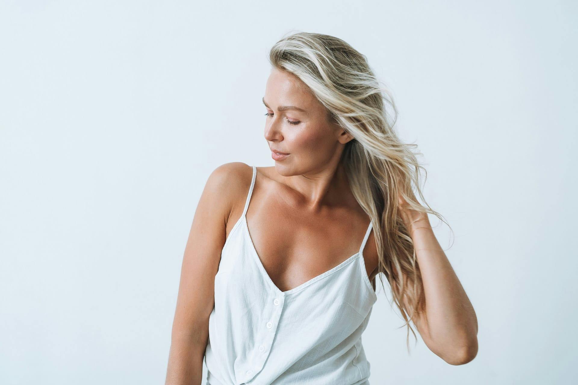 Blond woman in white dress