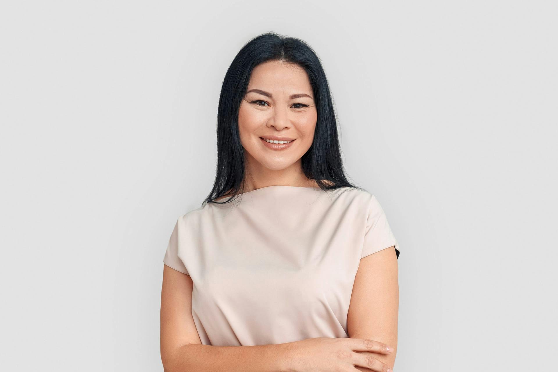 Smiling woman in tan dress