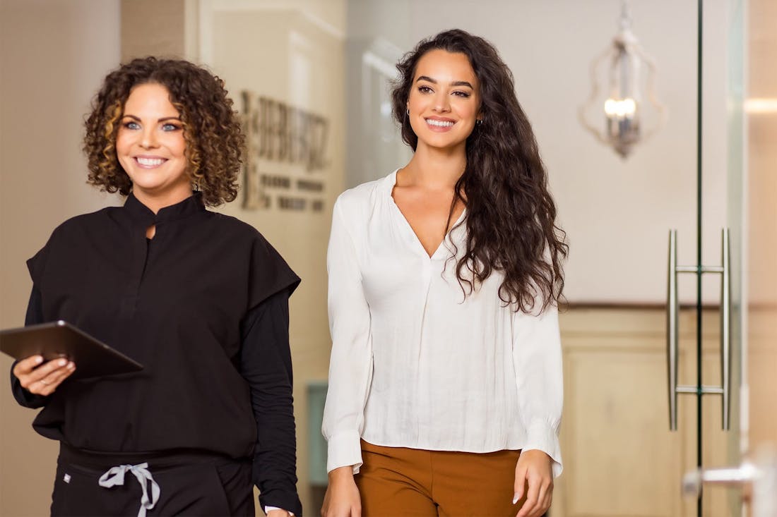 Office staff walking with client