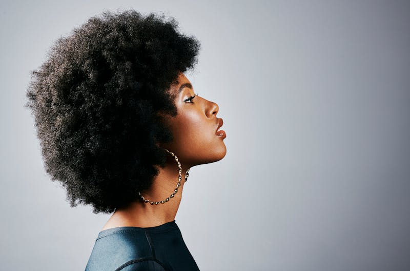 lady with side profile, nose shown, chin up and glowy skin
