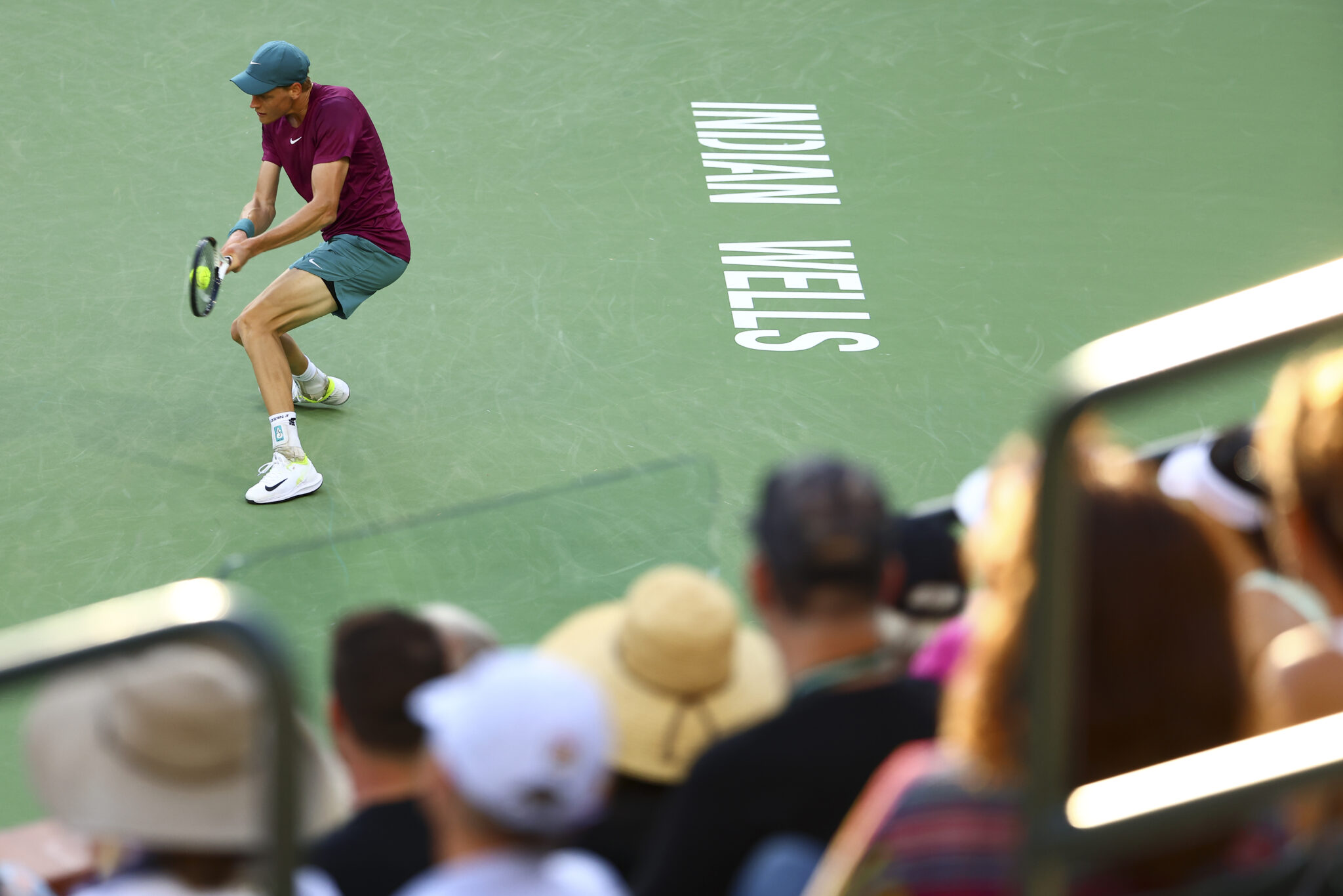 Jannik Sinner returning a shot