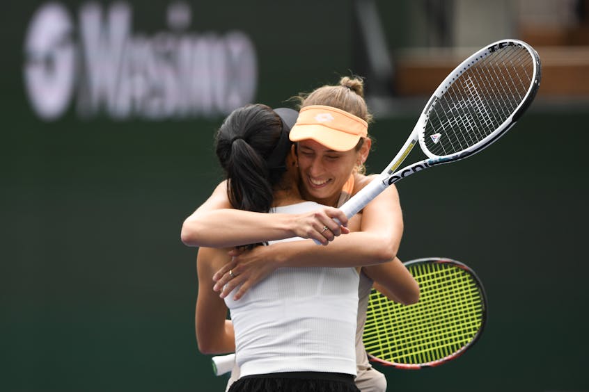 Hsieh and Mertens embrace with rackets still in hand after winning the 2024 BNP Paribas Open Women's Doubles final.