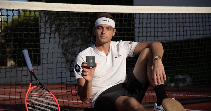 Fritz holding a Motorola Razr +