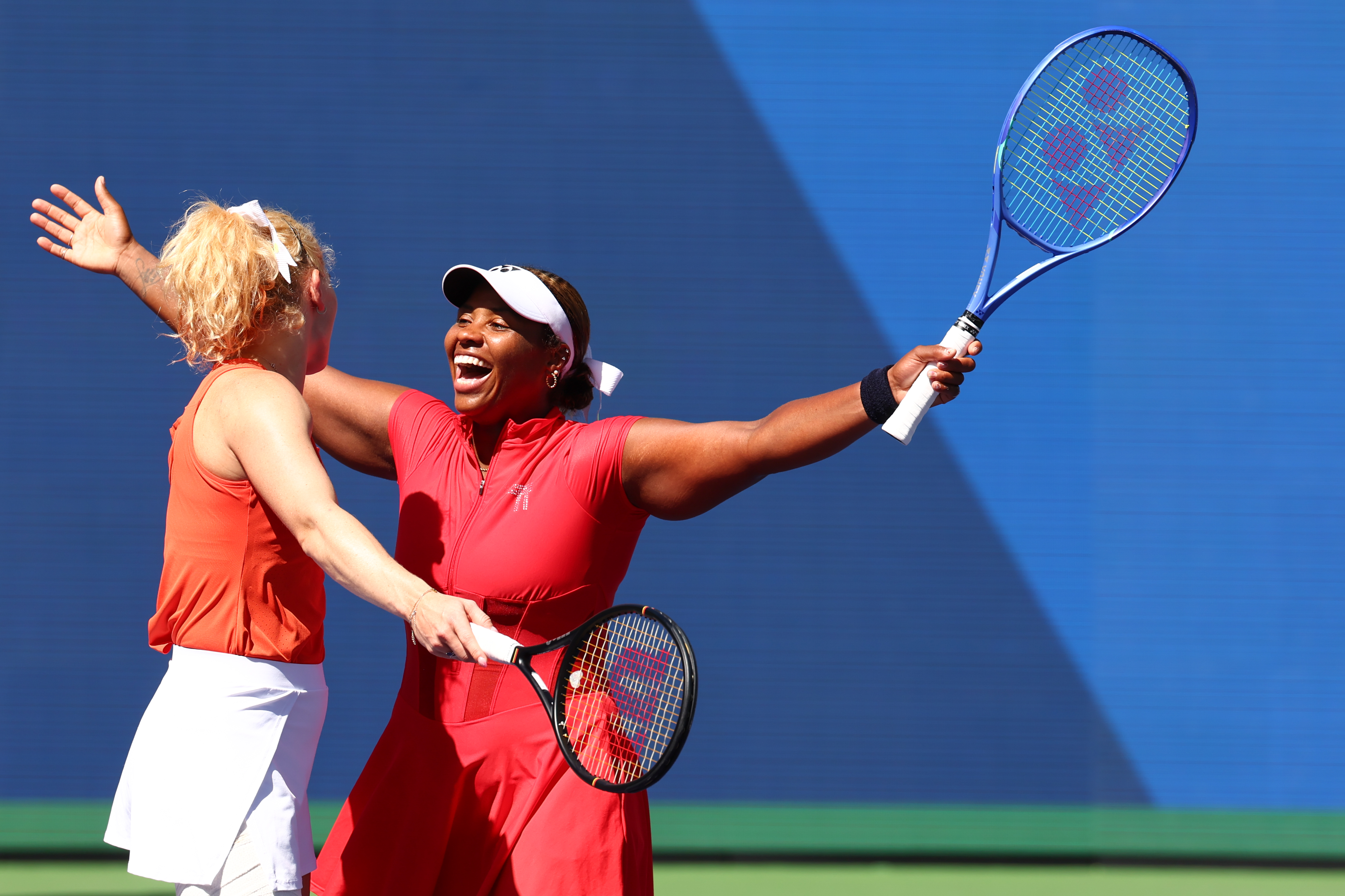 Katerina Siniakova and Taylor Townsend celebrate winning the women's doubles title.