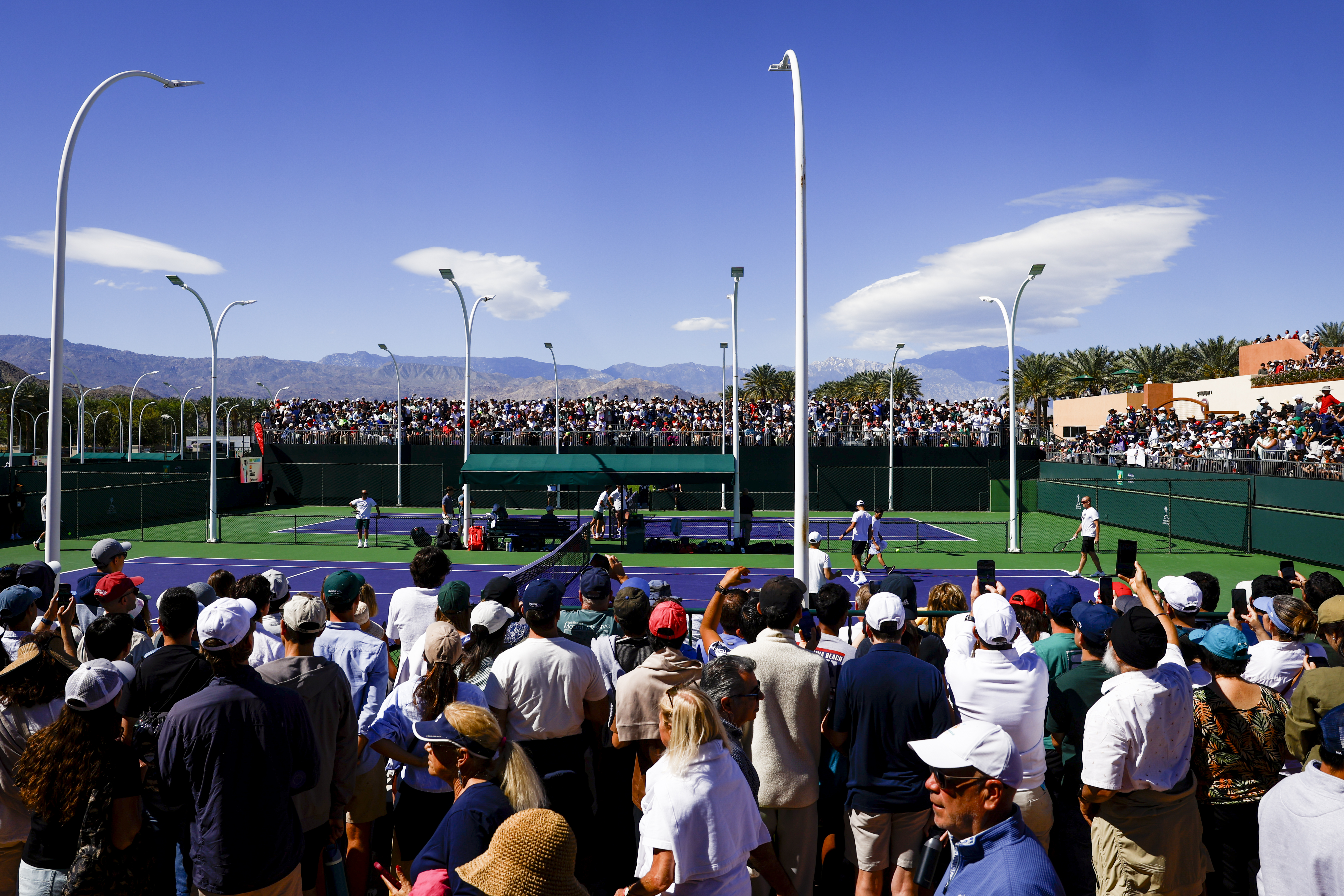 Fans pack the practice courts.